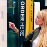 Beautiful blonde girl ordering mcdonald's online
