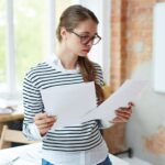 Girl reading papers