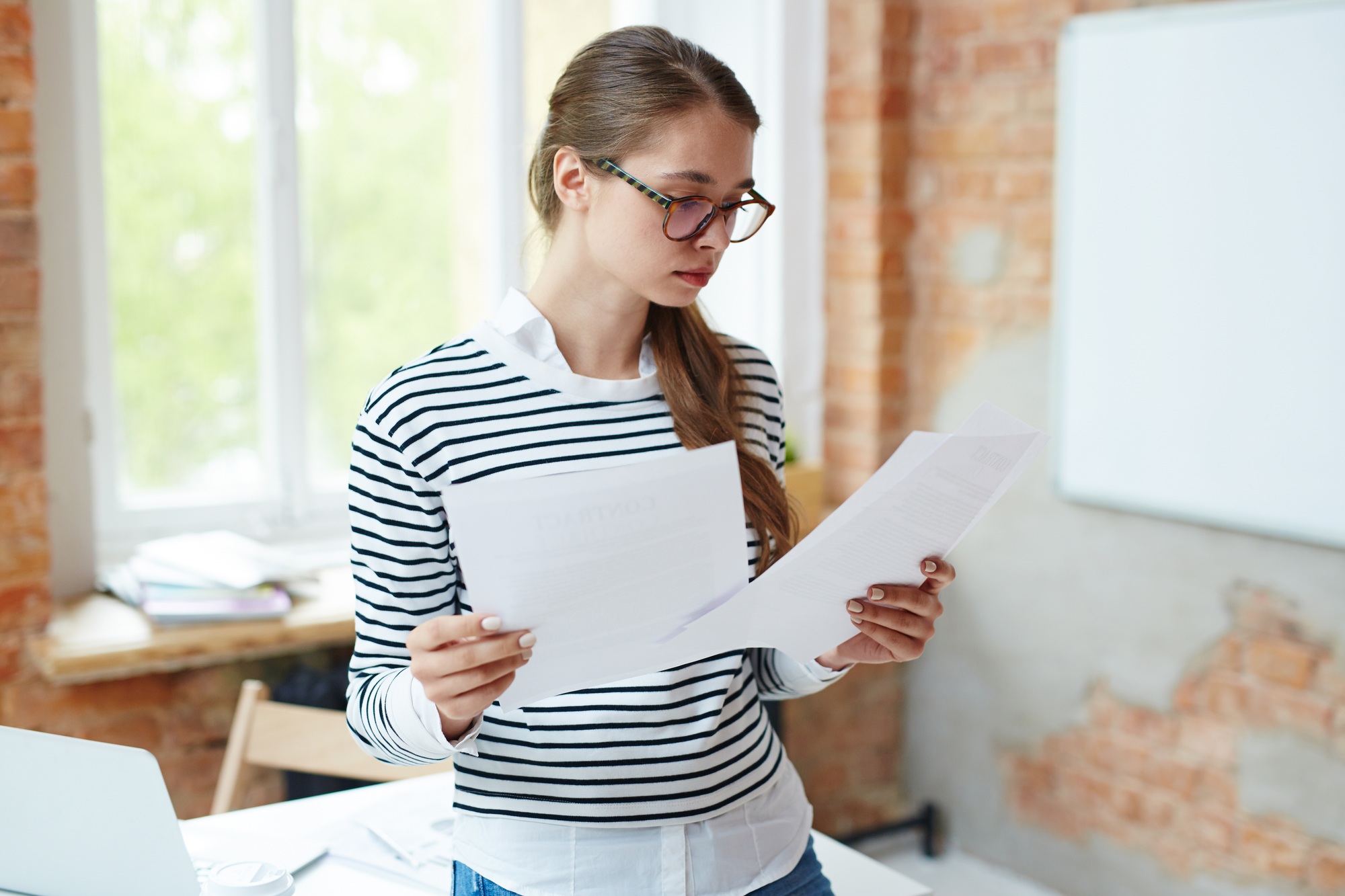 Girl reading papers