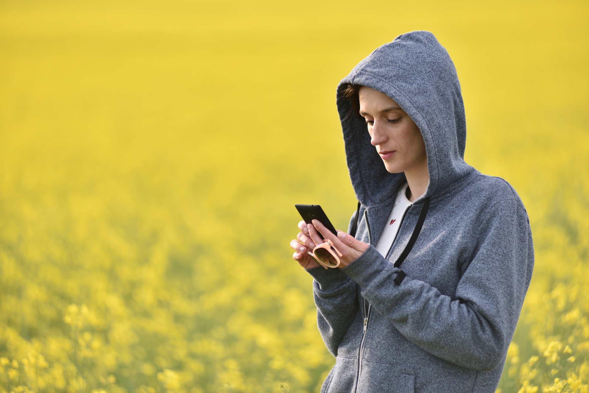 Girl texting a message on smart phone