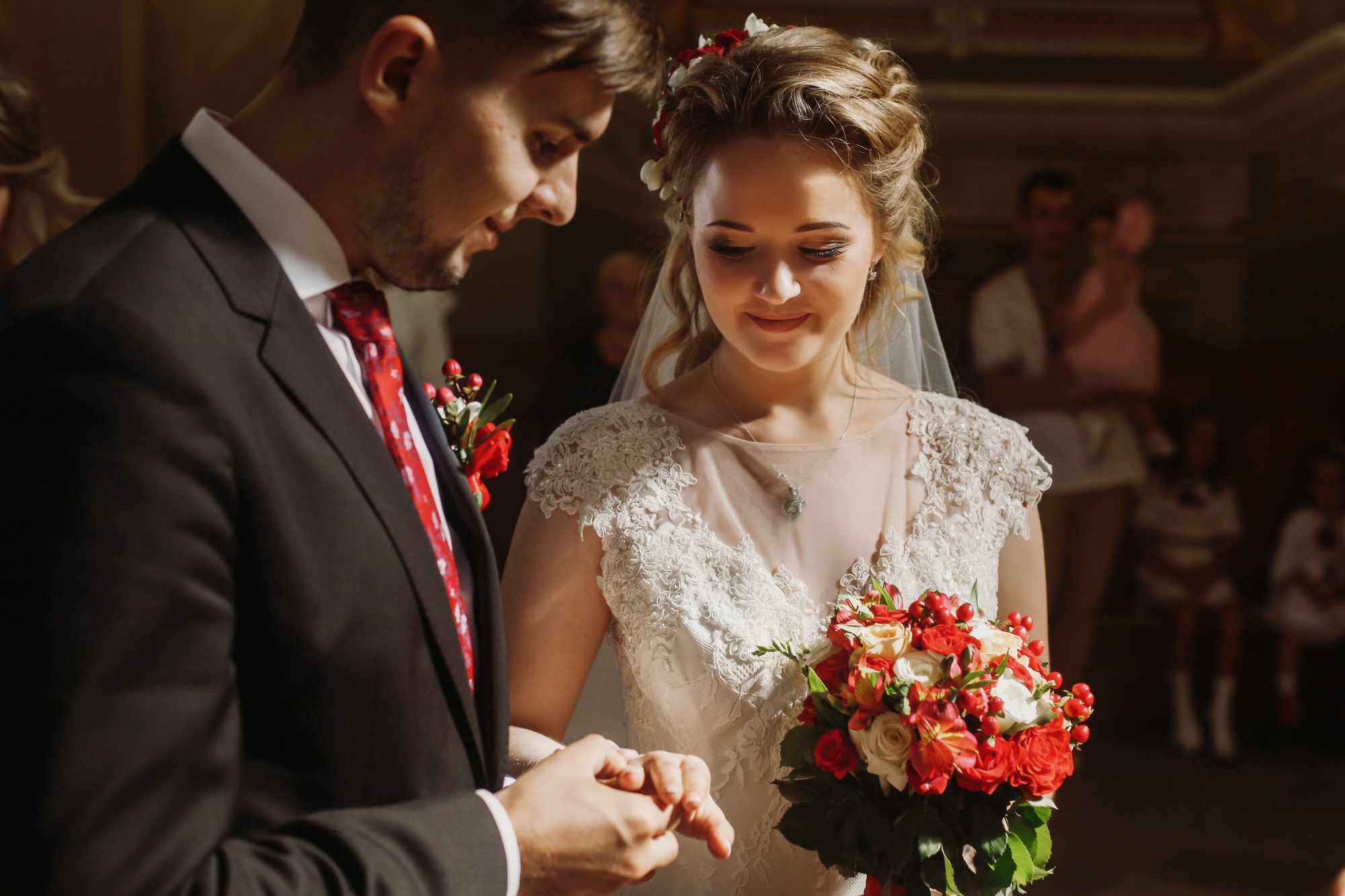 groom and bride in church during wedding ceremony,