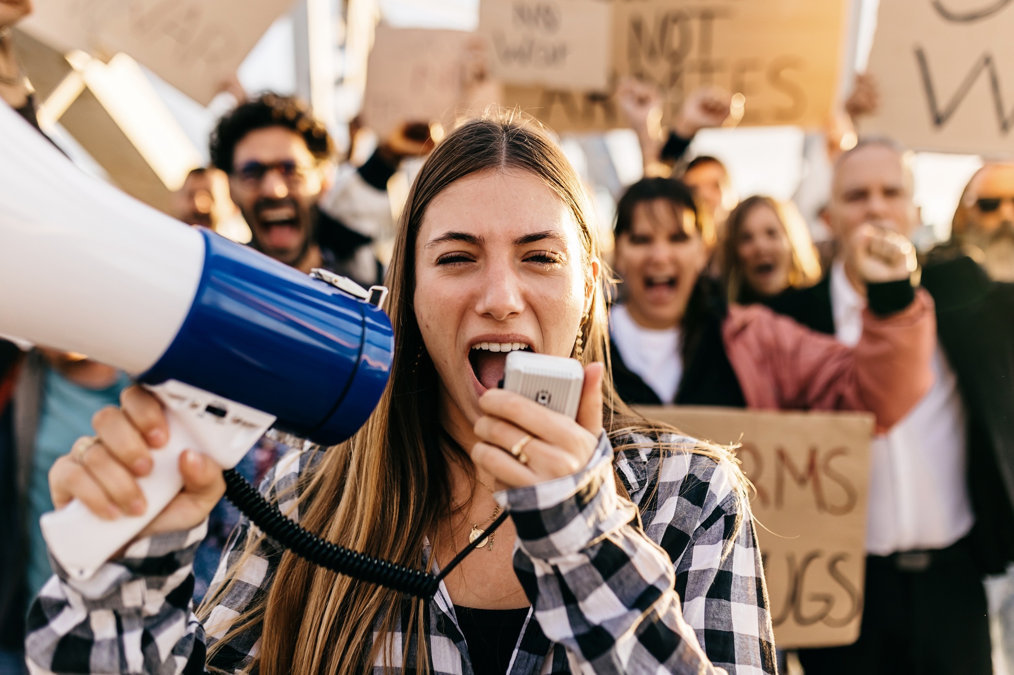 Group of diverse people manifesting against war or attack on a country