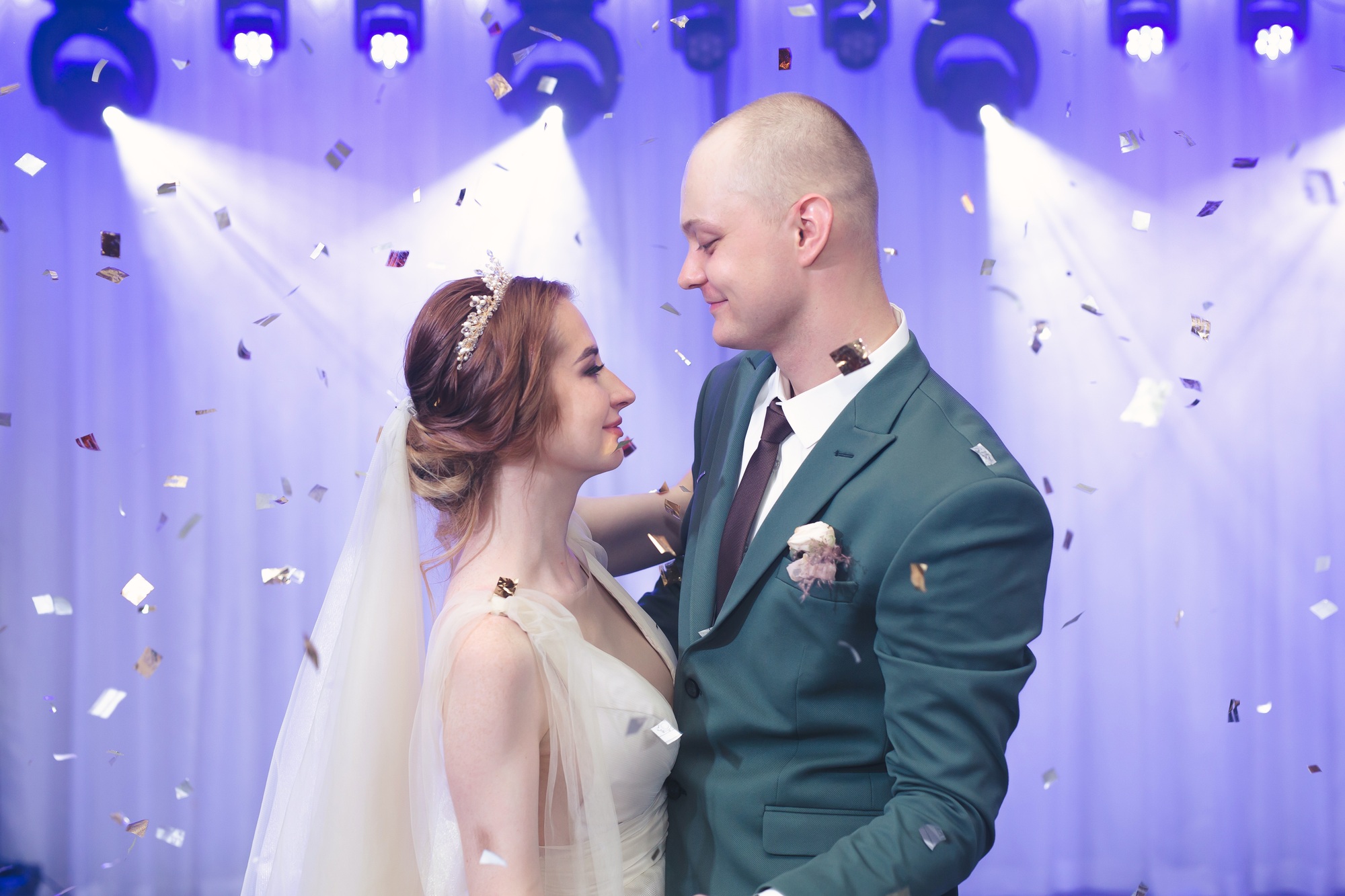 Happy bride and groom dancing, wedding in an elegant restaurant